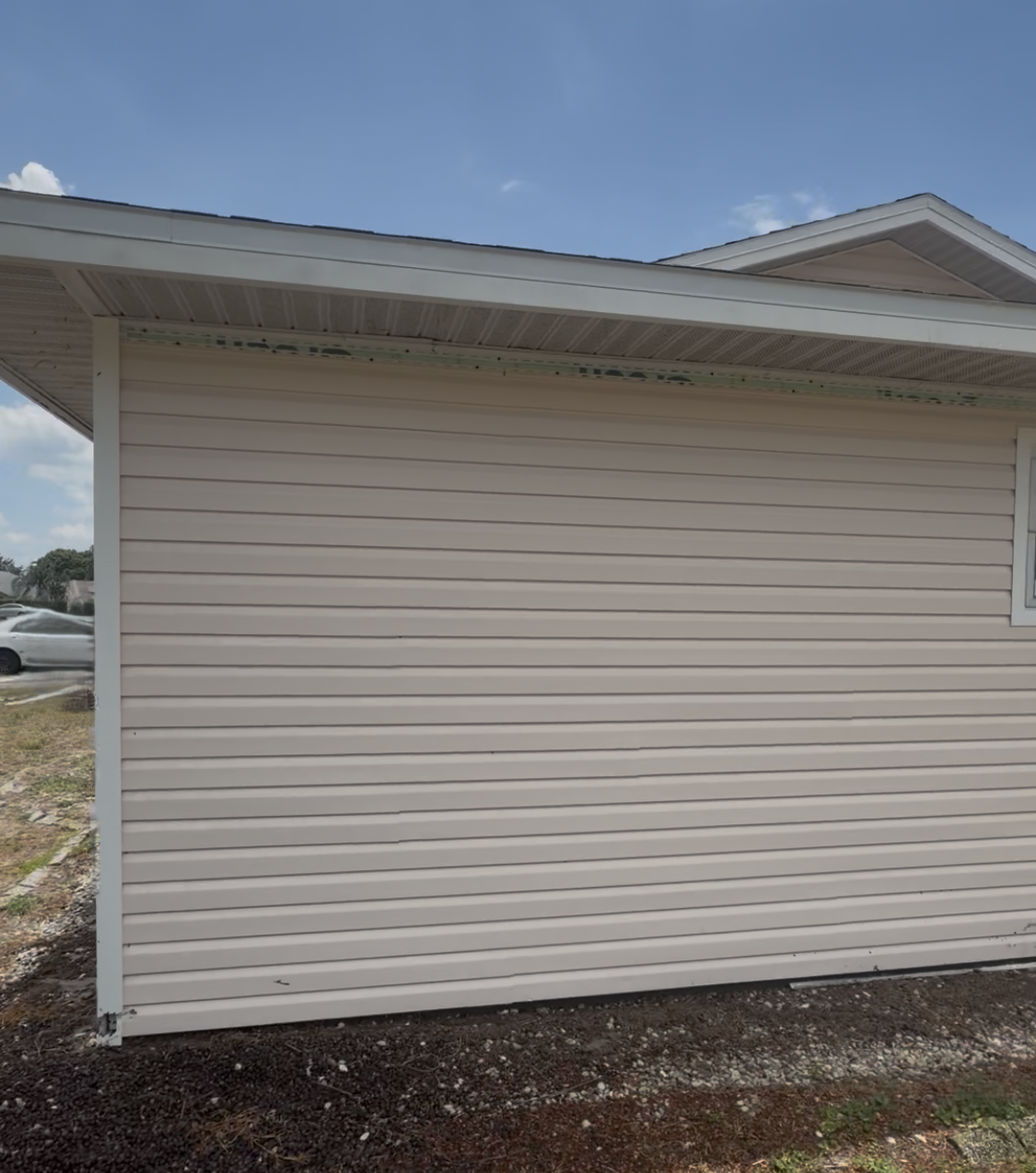 After: Clean bright house siding and surfaces - Lehigh Acres pressure washing